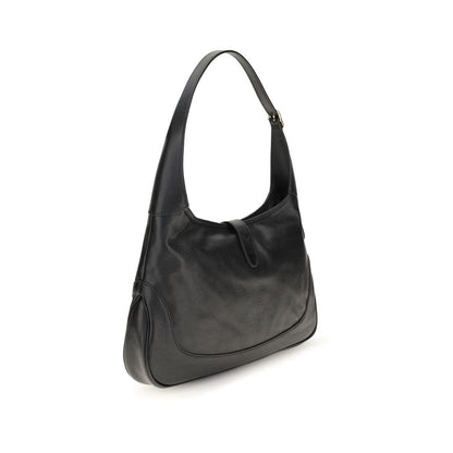 Medium Shoulder Bag by Gucci for women in bos taurus calf leather black, gold, natural & signature showcases a statuesque silhouette, artfully detailed with a secure zipper, organized , and versatile shoulder-strap & adjustable-strap for a statuesque look.