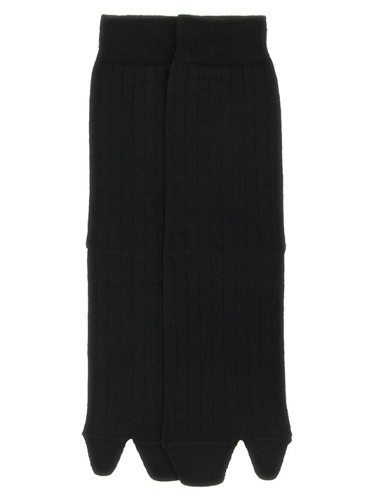 Socks by Maison Margiela for women in polyamide wool black, white & signature features a snug silhouette, artfully capturing the essence of the snug Aren Japanese Women's Polyamide Wool Socks design for a sophisticated look.
