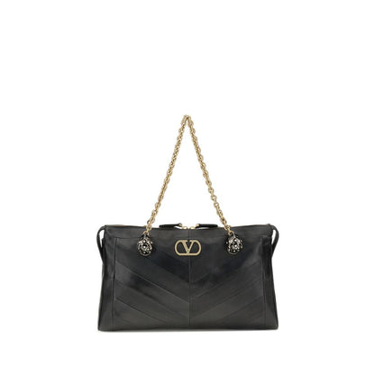 Medium Shoulder Bag by Valentino Garavani for women in leather & brass black, chevron, signature & patchwork showcases a statuesque silhouette, artfully detailed with a secure zipper & button, organized , and versatile shoulder-strap & handle for a statuesque look.
