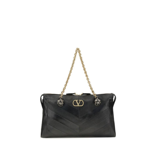 Medium Shoulder Bag by Valentino Garavani for women in leather & brass black, chevron, signature & patchwork showcases a statuesque silhouette, artfully detailed with a secure zipper & button, organized , and versatile shoulder-strap & handle for a statuesque look.