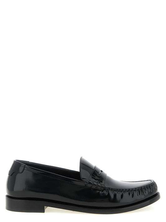 Loafer Slip-On Shoes by Saint Laurent for men in calfskin leather black features an dynamic silhouette from the Essence Men's Calfskin Leather Loafer Slip-On Shoes collection, defined by a dynamic and for a dynamic look.