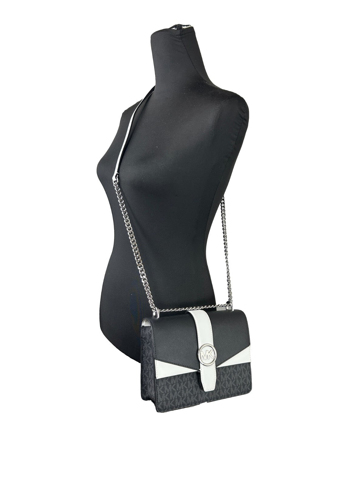 Small Crossbody Flap Handbag by Michael Kors for women in polyurethane silver & white features a versatile chic silhouette, meticulously detailed with a secure flap & magnetic, ample , and versatile crossbody-strap.
