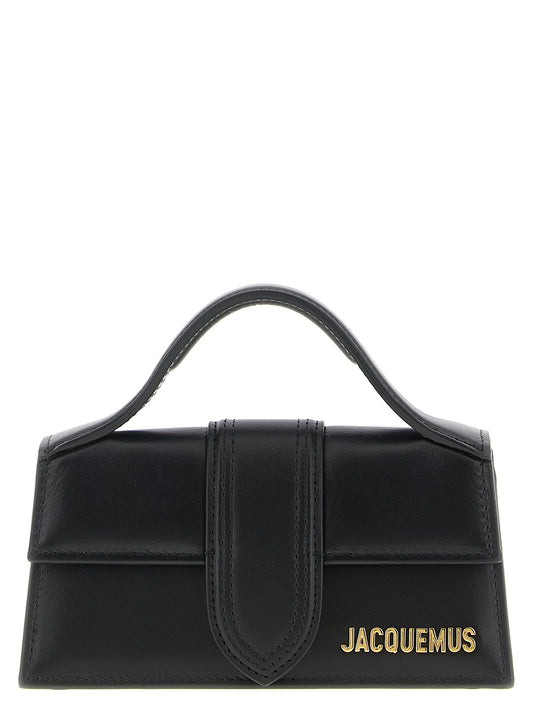 Flap Handbag by Jacquemus for women in leather black & natural features a contemporary silhouette, showcasing a secure flap & magnetic, ample , and contemporary shoulder-strap, handle & adjustable-strap for a sophisticated look.