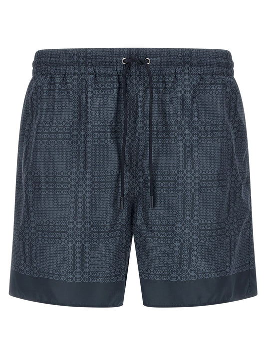 Swim Shorts from Gucci for men in polyester & mesh blue & print features an sleek silhouette, showcasing the distinct style of the Gg Men's Polyester & Mesh Swim Shorts collection.