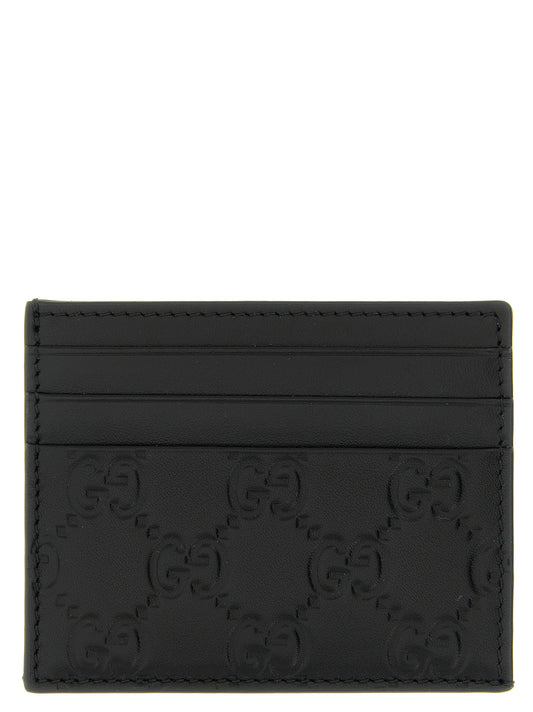 Cardholder Card Case by Gucci for men in calfskin leather black & patterned features a sleek silhouette, showcasing the sleek design of the Gg Calfskin Leather Cardholder Card Case with functional card-organization for a premium look.