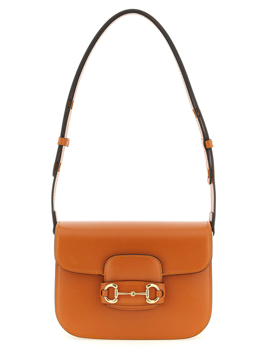 Shoulder Flap Bag by Gucci for women in calfskin leather orange presents a statuesque silhouette, showcasing a secure flap and statuesque with versatile shoulder-strap & adjustable-strap for a sophisticated look.
