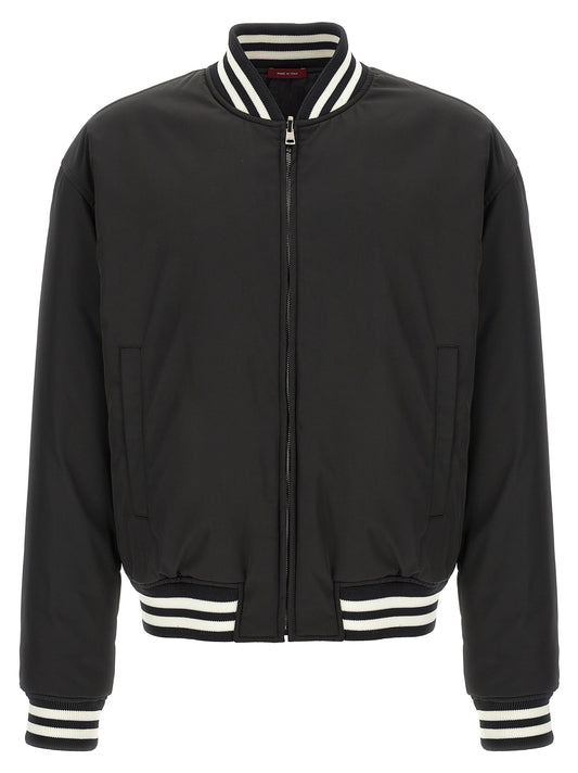 Bomber Jacket by Gucci for men in polyester twill & nylon bicolour, black, white & patterned showcases a bohemian silhouette, artfully detailed with a bohemian high-neck neckline and signature pockets for a truly bohemian finish.