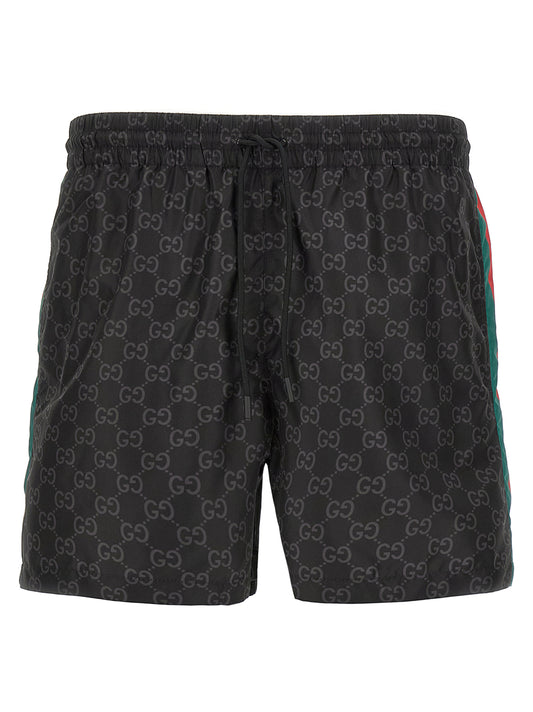 Swim Shorts by Gucci for men in nylon black & print features a resort ready silhouette, capturing the beach-ready style of the Gg Men's Nylon Swim Shorts collection.