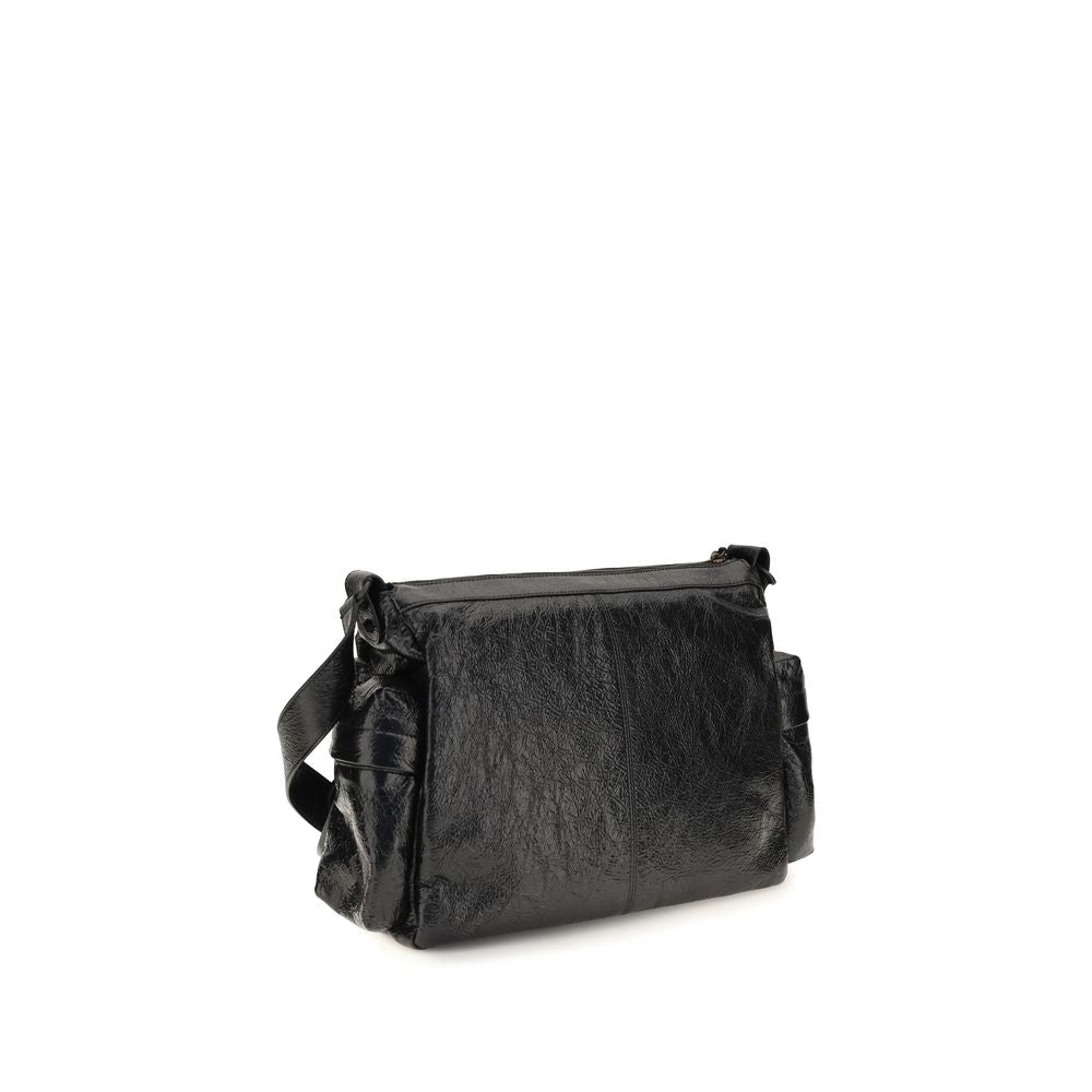 Medium 2-in-1 Shoulder & Crossbody Bag by Balenciaga for men in brass zamak & calf leather black showcases a statuesque silhouette, artfully detailed with a secure zipper, organized , and versatile crossbody-strap, shoulder-strap & adjustable-strap for a statuesque look.