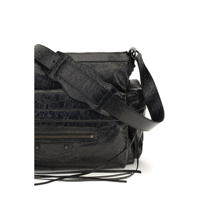 Medium 2-in-1 Shoulder & Crossbody Bag by Balenciaga for men in brass zamak & calf leather black features a effortless chic silhouette with a secure zipper, ample , and versatile crossbody-strap, shoulder-strap & adjustable-strap for a effortless chic finish.