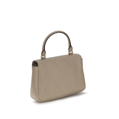 Mini Quilted Flap Handbag by Tory Burch for women in bos taurus calf grained leather beige features a refined silhouette, showcasing a secure flap, zipper & magnetic, organized cardholder, and versatile adjustable-strap & handle for a refined finish.