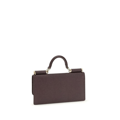 Micro Shoulder Flap Bag by Dolce & Gabbana for women in bos taurus calf leather brown & signature features an effortlessly chic silhouette with a secure flap, magnetic & button, ample , and versatile shoulder-strap & handle for effortlessly chic everyday luxury.