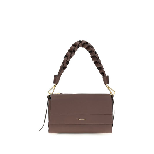 Shoulder Flap Bag by Coccinelle for women in bos taurus calf leather brown features a effortless sophistication silhouette, secured by a flap, zipper & magnetic with ample external-pockets and versatile shoulder-strap, adjustable-strap & handle for a effortless sophistication finish.