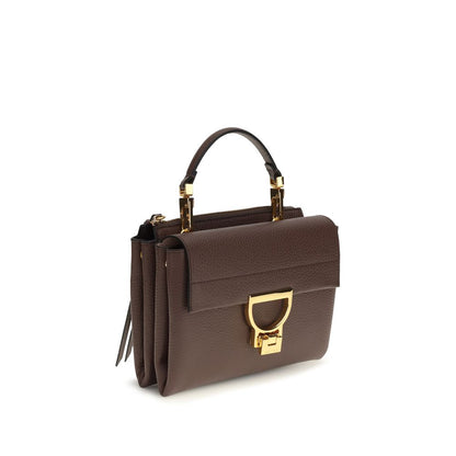 Flap Handbag by Coccinelle for women in bos taurus calfskin leather brown, gold & monogram features an refined silhouette, showcasing a secure flap & zipper, ample , and versatile shoulder-strap, handle & adjustable-strap for a sophisticated refined aesthetic.