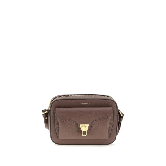 Shoulder Flap Bag by Coccinelle for women in bos taurus calfskin leather brown, gold & monogram features a effortless chic silhouette with a secure flap & zipper, ample , and versatile shoulder-strap & adjustable-strap for a effortless chic finish.