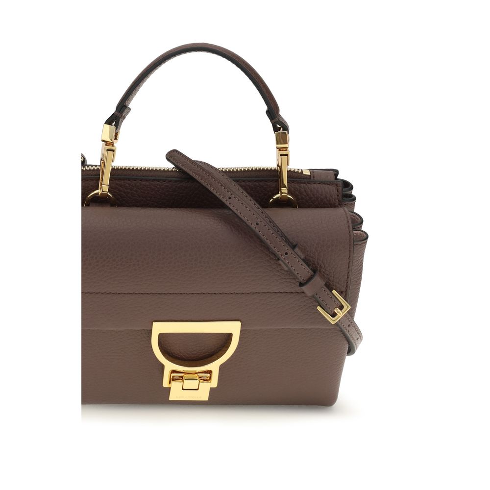 Flap Handbag by Coccinelle for women in bos taurus calfskin leather brown, gold & monogram presents a ornamental silhouette, showcasing a secure flap & zipper, ample , and versatile shoulder-strap, handle & adjustable-strap for a ornamental finish.