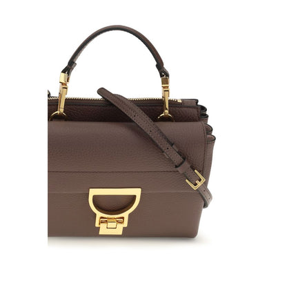 Flap Handbag by Coccinelle for women in bos taurus calfskin leather brown, gold & monogram presents a ornamental silhouette, showcasing a secure flap & zipper, ample , and versatile shoulder-strap, handle & adjustable-strap for a ornamental finish.