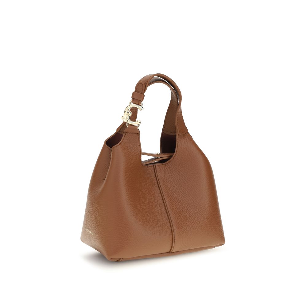 Small Crossbody Pouch Handbag by Coccinelle for women in bos taurus calf grained leather brown & gold features an refined silhouette, showcasing a secure zipper & button, ample , and versatile crossbody-strap, handle, adjustable-strap & detachable-strap for a sophisticated refined aesthetic.