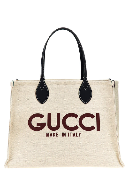 Shopper Pouch Tote Bag by Gucci for women in cotton & leather beige & print features an jet-setting Cotton & Leather Shopper Pouch Tote Bag design with a secure , jet-setting , and versatile handle for a jet-setting look.