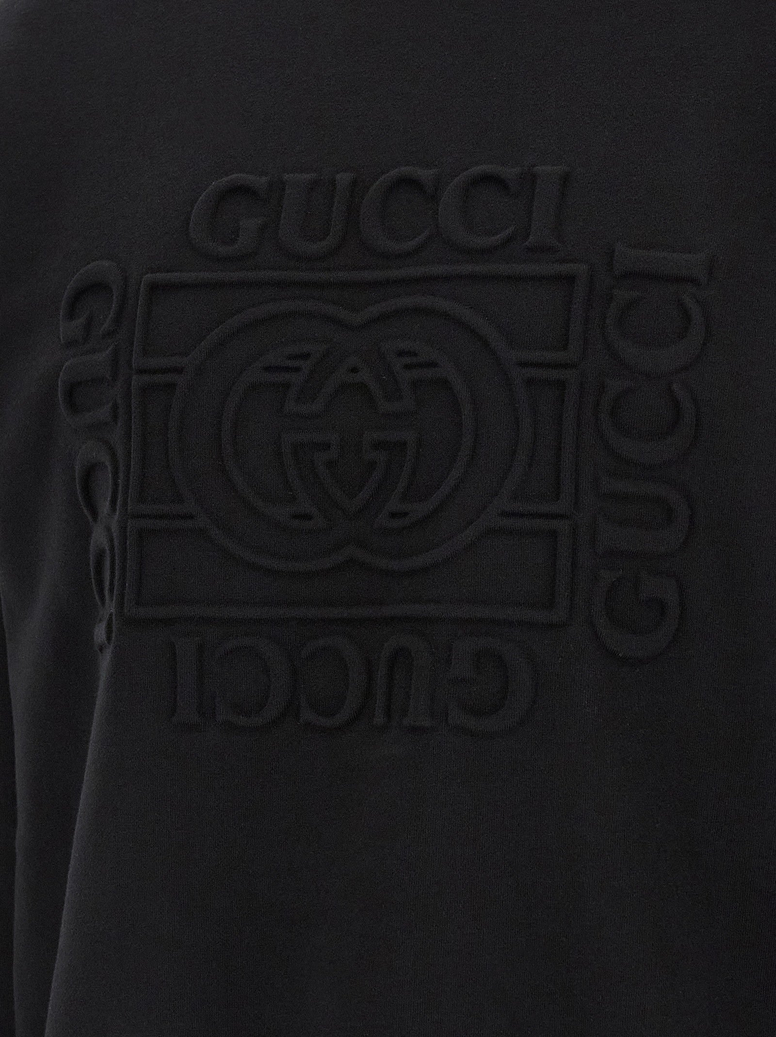 Sweatshirt by Gucci for men in cotton black features an provocated silhouette, detailed with a provocated and a refined for a sophisticated aesthetic.