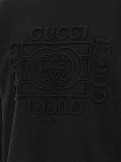 Sweatshirt by Gucci for men in cotton black features an provocated silhouette, detailed with a provocated and a refined for a sophisticated aesthetic.