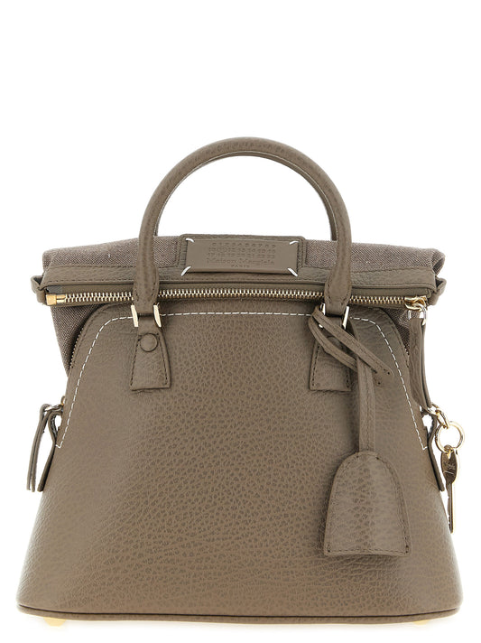 Mini Shoulder Bag by Maison Margiela for women in canvas caiman & calf leather gray, gold, white & signature features a enviable silhouette, showcasing a secure , ample , and enviable shoulder-strap, handle & adjustable-strap for a enviable finish.