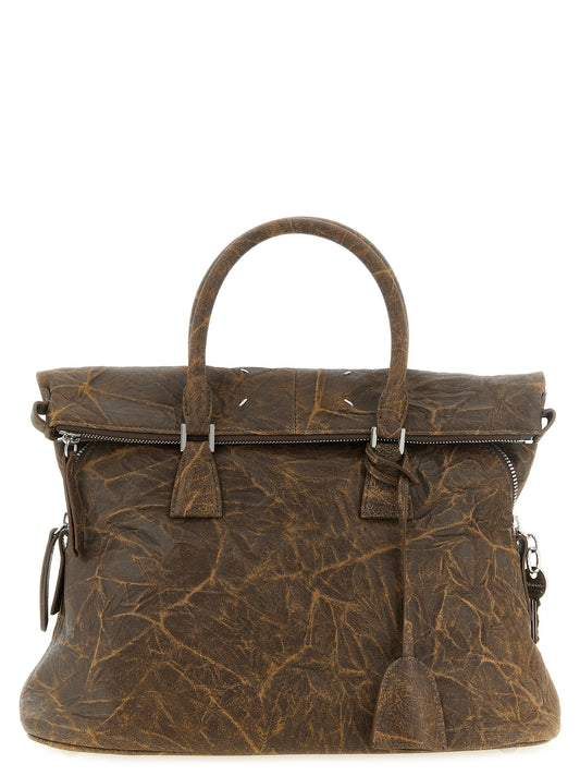 Shoulder Bag by Maison Margiela for women in viscose goat leather & fur brown & silver features a distinguished silhouette, showcasing a secure and distinguished with versatile shoulder-strap & adjustable-strap for a distinguished finish.