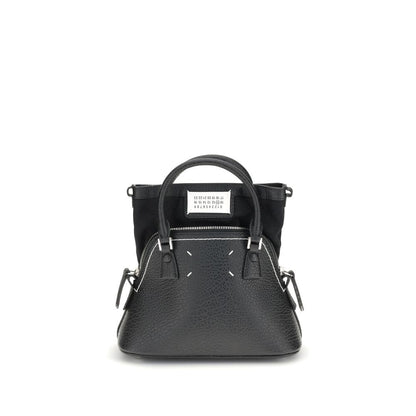 Shoulder Bag by Maison Margiela for women in bos taurus calf leather black, signature & monogram presents a statuesque silhouette, showcasing a secure zipper and statuesque internal-pockets with versatile shoulder-strap, handle & adjustable-strap for a sophisticated look.