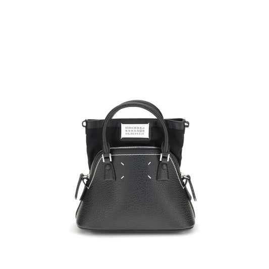 Shoulder Bag by Maison Margiela for women in bos taurus calf leather black, signature & monogram presents a statuesque silhouette, showcasing a secure zipper and statuesque internal-pockets with versatile shoulder-strap, handle & adjustable-strap for a sophisticated look.