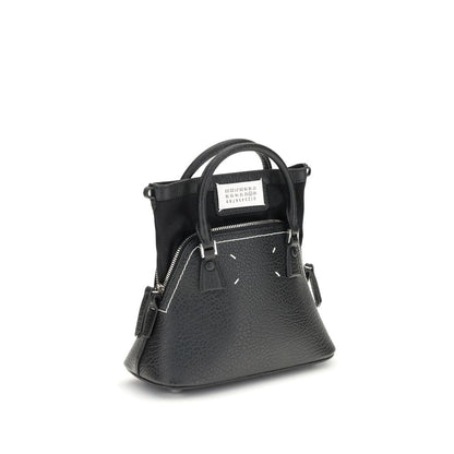 Shoulder Bag by Maison Margiela for women in bos taurus calf leather black, signature & monogram features an effortlessly chic silhouette with a secure zipper, ample internal-pockets, and versatile shoulder-strap, handle & adjustable-strap for effortlessly chic everyday luxury.