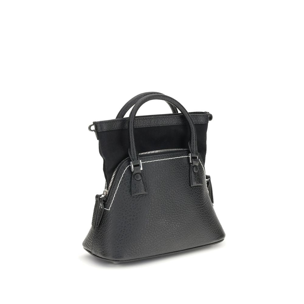 Shoulder Bag by Maison Margiela for women in bos taurus calf leather black, signature & monogram features a stately silhouette, showcasing a secure zipper, ample internal-pockets, and stately shoulder-strap, handle & adjustable-strap for a stately finish.