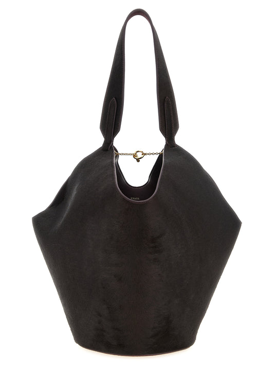 This Small Shopper Tote Bag by Khaite for women in calfskin leather bordeaux & gold features an jet-set Lotus Calfskin Leather Small Shopper Tote Bag design with a secure , ample , and jet-set handle.