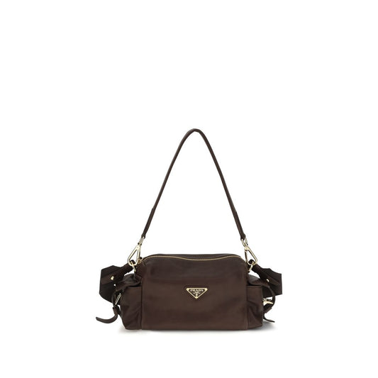Shoulder Flap Bag by Prada for women in bos taurus calf leather & polyurethane brown features a stately silhouette, showcasing a secure flap, zipper & buckle, ample , and stately shoulder-strap, adjustable-strap & detachable-strap for a stately finish.