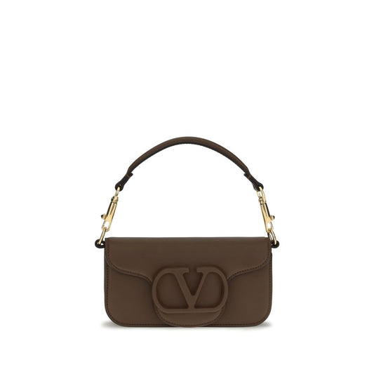 Mini 2-in-1 Shoulder & Crossbody Bag by Valentino Garavani for women in bos taurus calfskin leather brown, gold & signature showcases a statuesque silhouette, artfully detailed with a secure magnetic, organized , and versatile crossbody-strap, shoulder-strap, detachable-strap & handle for a statuesque look.