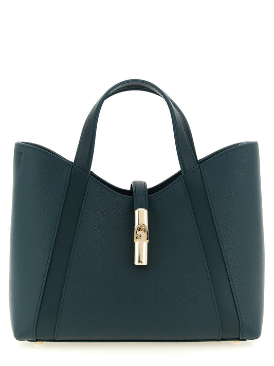 Tote Bag by Furla for women in calfskin leather & cotton bicolour, gold, green & teal features an jet-setting Goccia Calfskin Leather & Cotton Tote Bag design with a secure zipper, jet-setting , and versatile handle & adjustable-strap for a jet-setting look.