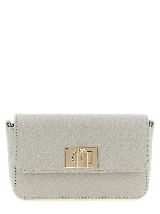 Mini Crossbody Flap Handbag by Furla for women in calfskin leather gray features an multi-faceted design with a secure flap & turn-lock, ample , and versatile crossbody-strap for a multi-faceted finish.