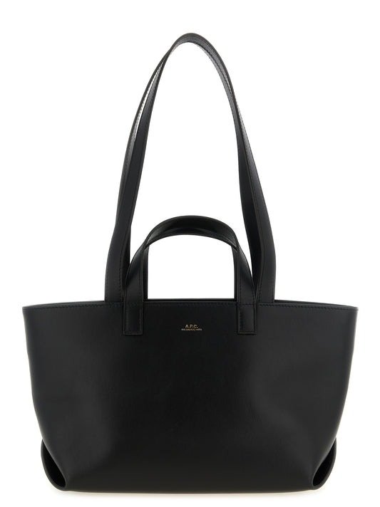 Small Shopper Tote Clutch Bag by A.P.C. for women in cotton polyester canvas black & gold features a jet-set Le Drummer Cotton Polyester Canvas Small Shopper Tote Clutch Bag design, complete with a secure zipper, ample , and versatile handle for a jet-set look.