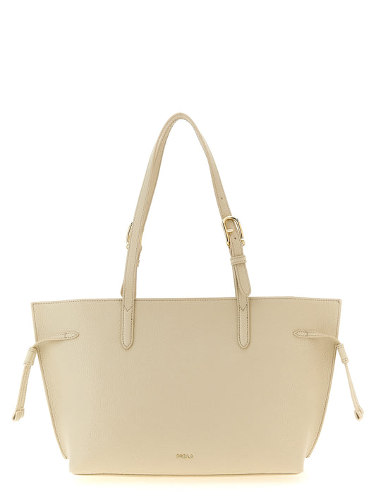 This Pouch Tote Bag by Furla for women in calfskin leather burgundy, cream, gold & white features an jet-set 1927 Ava Calfskin Leather Pouch Tote Bag design with a secure zipper & buckle, ample , and jet-set handle & adjustable-strap.