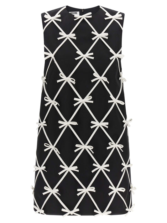 Dress by Moschino for women in virgin wool bicolour & patterned features an cute silhouette, detailed with a sleeveless and round neckline that elegantly flows into a cute short mini.