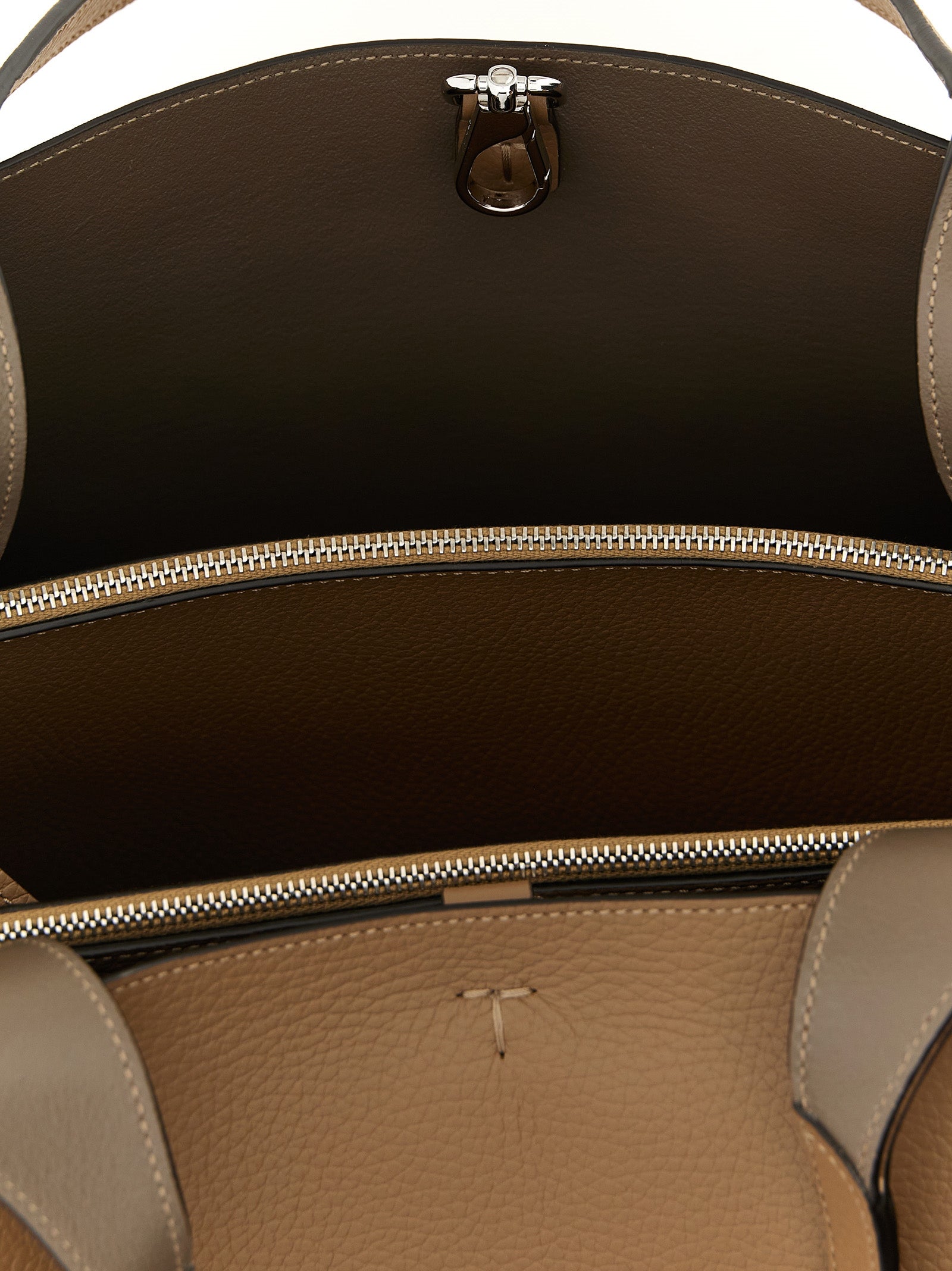 Medium Tote Bag by Tod's for women in calfskin leather brown, camel, silver & signature features an jet-set Essence T Timeless Calfskin Leather Medium Tote Bag design with a secure hook, ample built-in-compartments, and versatile handle for an jet-set finish.