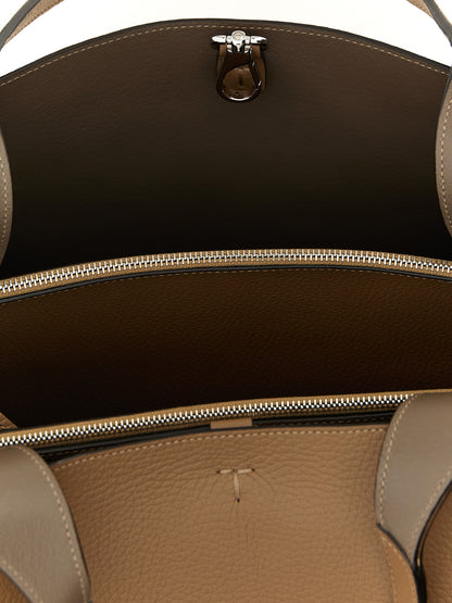 Medium Tote Bag by Tod's for women in calfskin leather brown, camel, silver & signature features an jet-set Essence T Timeless Calfskin Leather Medium Tote Bag design with a secure hook, ample built-in-compartments, and versatile handle for an jet-set finish.