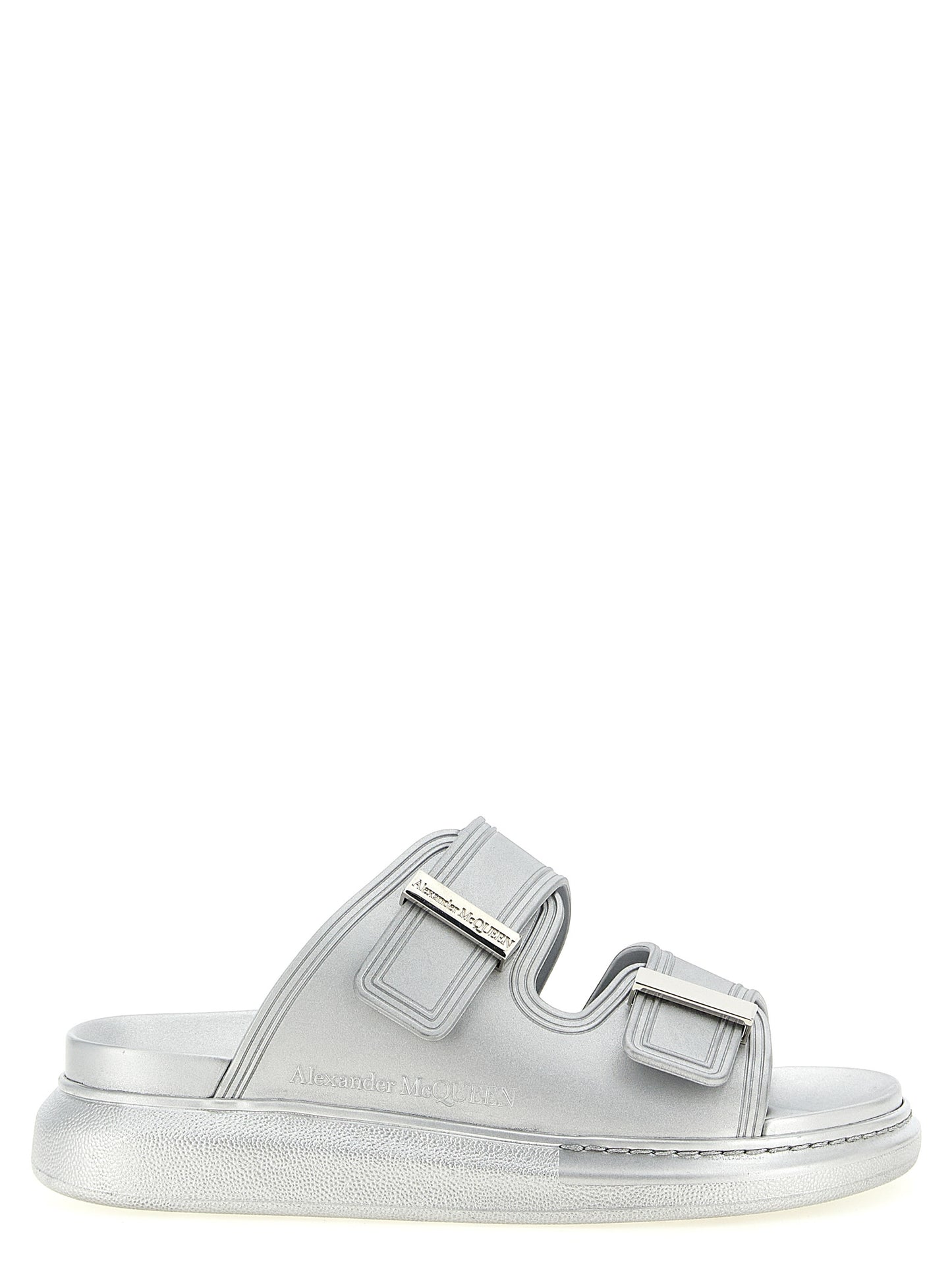 Sliders Sandals Flat Shoes by Alexander McQueen for women in rubber silver showcases a enchanting silhouette as part of the Women's Rubber Sliders Sandals Flat Shoes collection, defined by a enchanting and for a enchanting look.