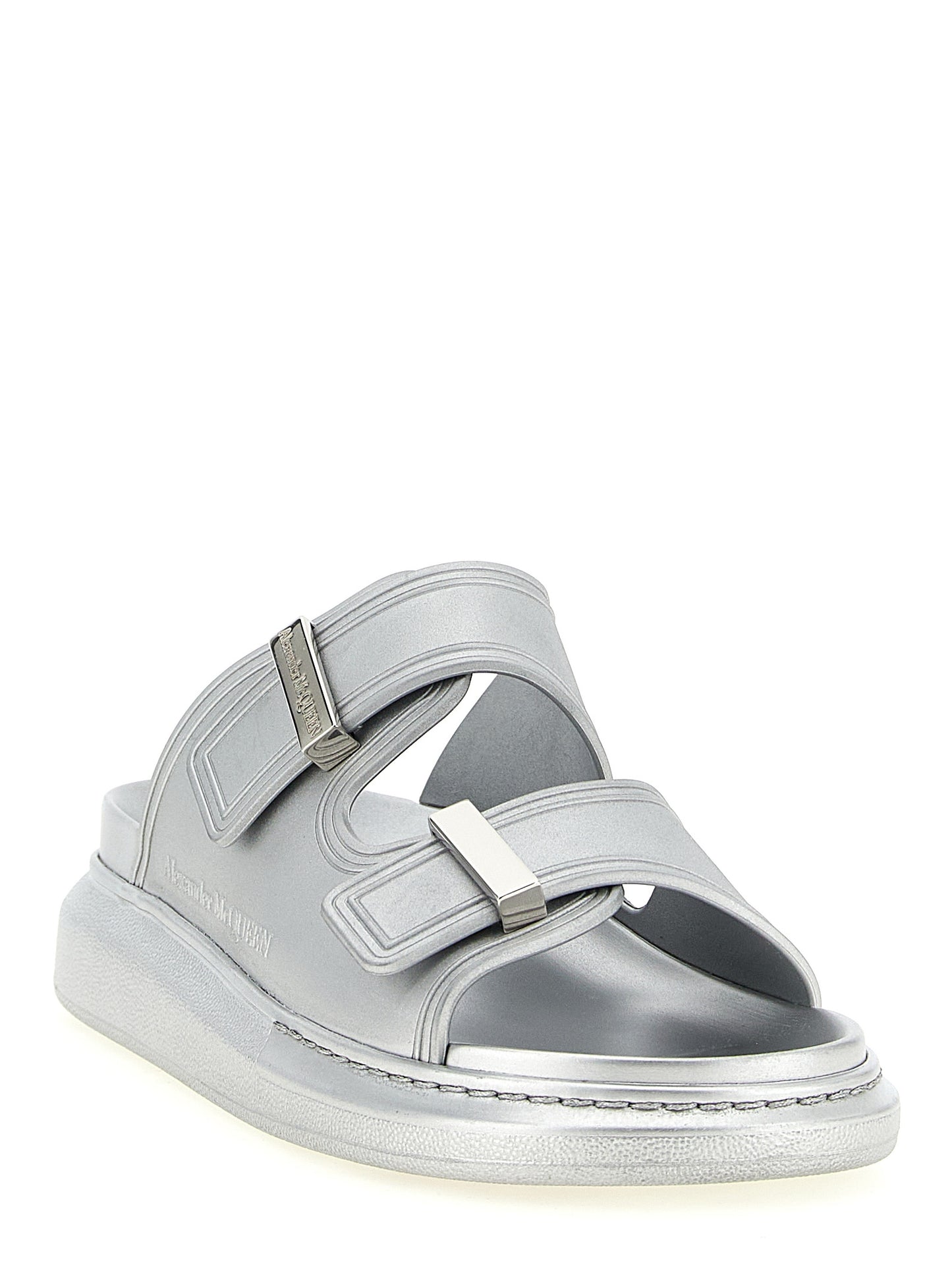 Sliders Sandals Flat Shoes by Alexander McQueen for women in rubber silver presents a impeccable silhouette as Women's Rubber Sliders Sandals Flat Shoes, artfully designed with a and a impeccable for a refined, upscale finish.