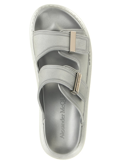 Sliders Sandals Flat Shoes by Alexander McQueen for women in rubber silver showcases a dynamic silhouette, artfully capturing Women's Rubber Sliders Sandals Flat Shoes through its distinctive and elegant .