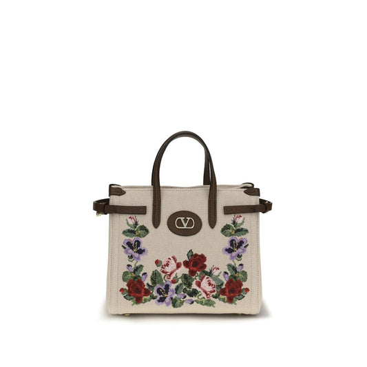 Mini Shoulder Bag by Valentino Garavani for women in grained leather beige, natural, floral & signature features a stately silhouette, showcasing a secure zipper & buckle, ample single-compartment, and stately shoulder-strap, handle, adjustable-strap & detachable-strap for a stately finish.