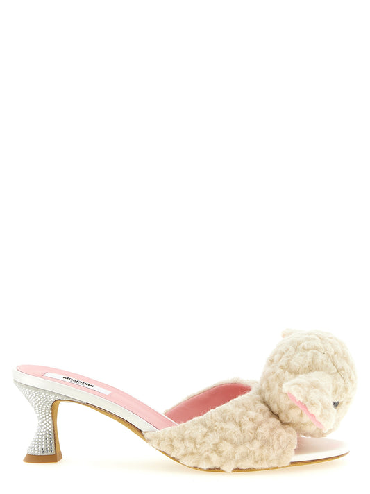 Mules Sandals Flat Shoes by Moschino for women in sheep leather & virgin wool cream, pink & white features an captivating silhouette, showcasing the captivating style of the Women's Sheep Leather & Virgin Wool Mules Sandals Flat Shoes with its distinct and refined .