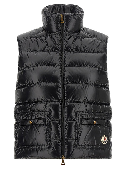 Vest by Moncler for women in polyamide black showcases a dynamic silhouette, perfectly balancing pockets with a dynamic high-neck neckline for a sophisticated, high-fashion look.