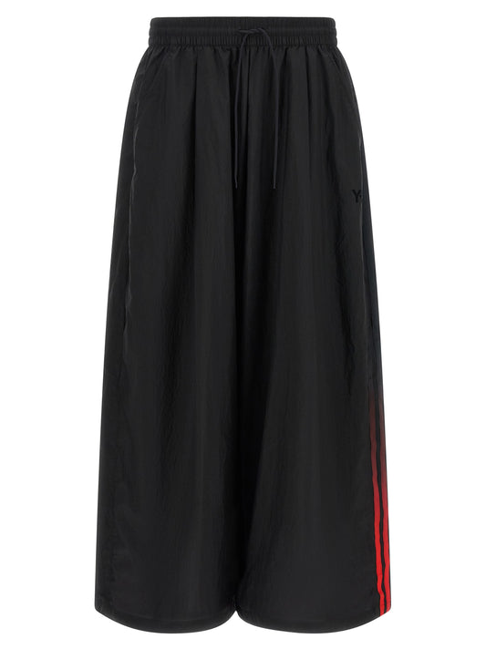 Activewear Pants by Y-3 for men in polyamide gradient, black, red & striped features an versatile silhouette, integrating performance-ready with a versatile athletic, relaxed-fit & wide, long, and .