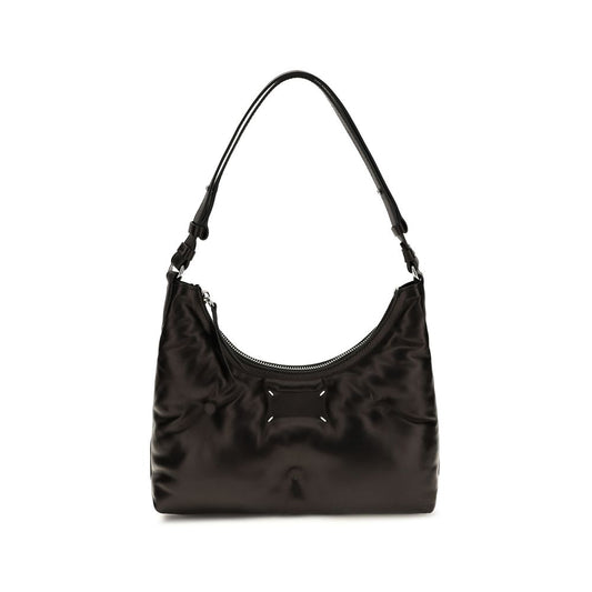 Small Quilted Shoulder Hobo Bag by Maison Margiela for women in leather black & signature presents a statuesque silhouette, showcasing a secure zipper and statuesque with versatile shoulder-strap for a sophisticated look.