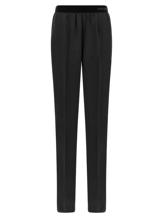 Pajamas by Tom Ford for women in silk black features an ethereal silhouette, artfully capturing the ethereal aesthetic of Women's Silk Pajamas with a focus on refined comfort.